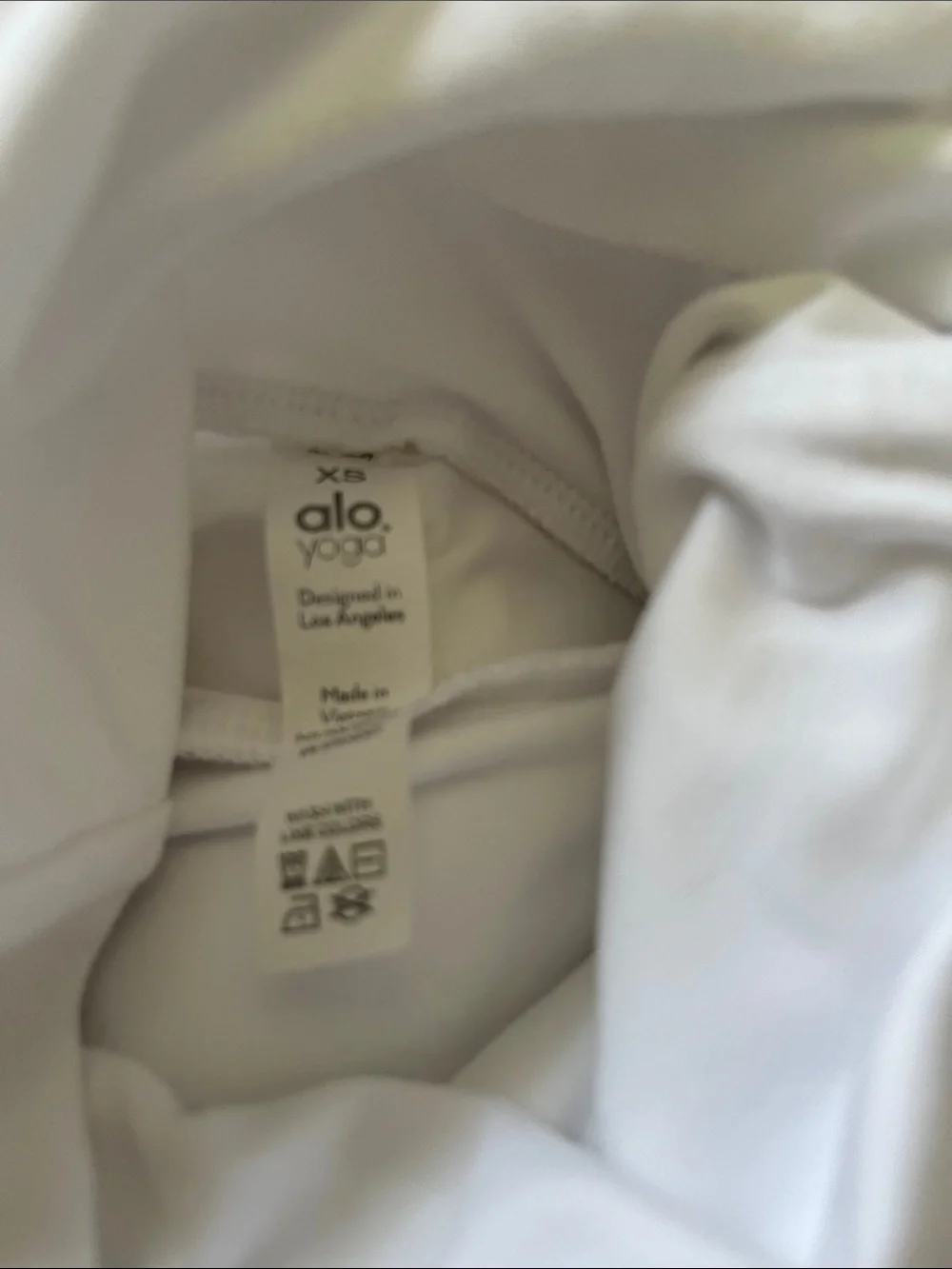 White full turtle neck top with thumb holes